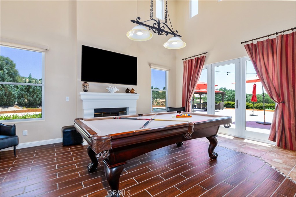 2191 Lake Ysabel Road Templeton, CA 93465 - Photo 12 of 73 a living room with furniture a flat screen tv and a floor to ceiling window