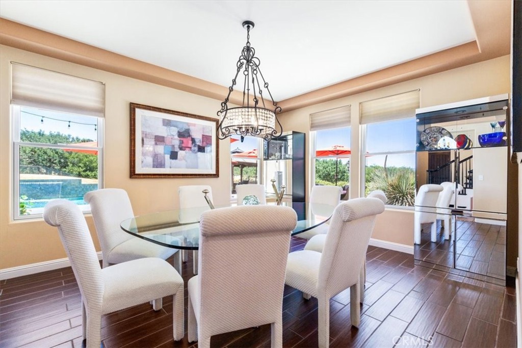 2191 Lake Ysabel Road Templeton, CA 93465 - Photo 16 of 73 a dining room with furniture a chandelier and wooden floor