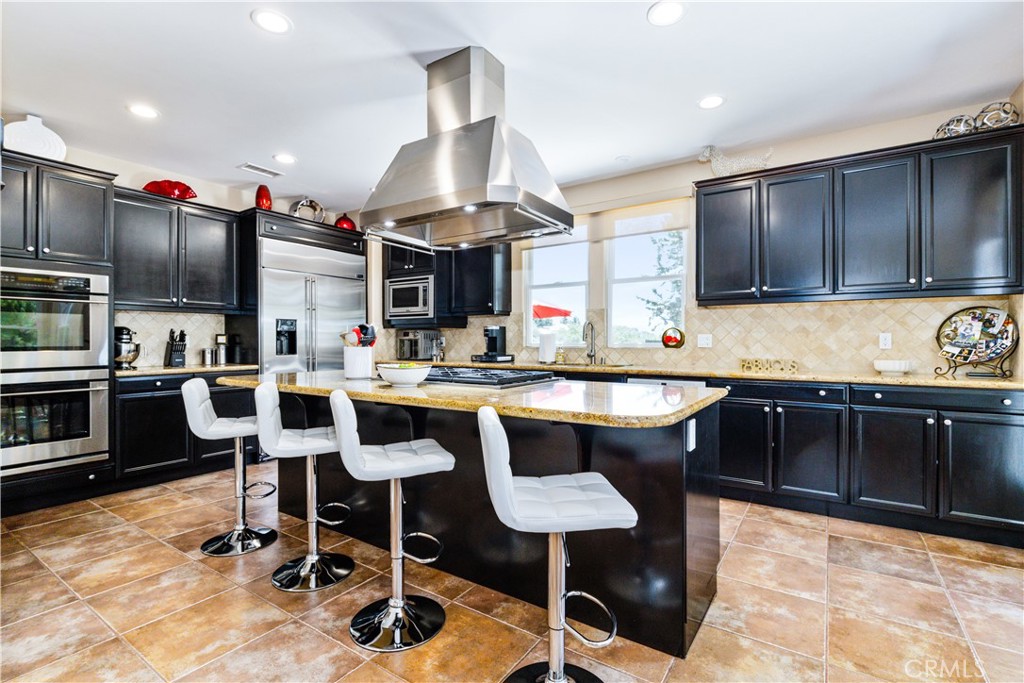 2191 Lake Ysabel Road Templeton, CA 93465 - Photo 17 of 73 a kitchen with stainless steel appliances granite countertop a sink a stove and chairs