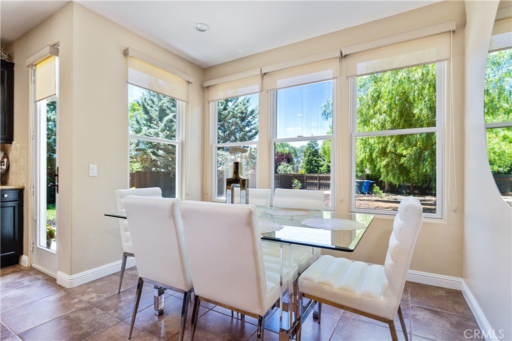 2191 Lake Ysabel Road Templeton, CA 93465 - Photo 28 of 73 a view of a dining room with furniture large windows and wooden floor