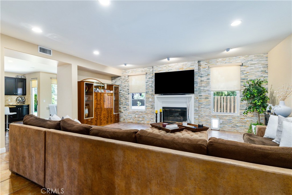 2191 Lake Ysabel Road Templeton, CA 93465 - Photo 31 of 73 a living room with furniture a fireplace and a flat screen tv