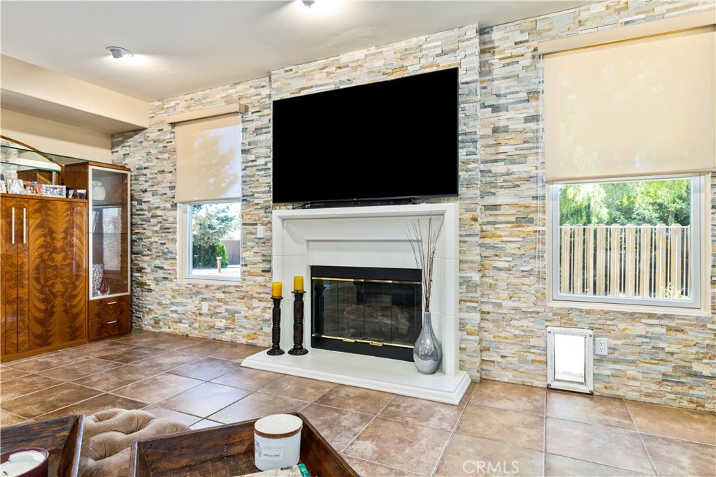 2191 Lake Ysabel Road Templeton, CA 93465 - Photo 34 of 73 a living room with furniture a flat screen tv and a fireplace