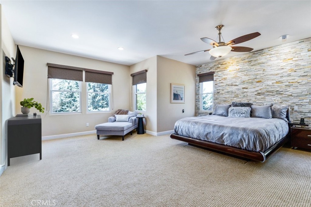 2191 Lake Ysabel Road Templeton, CA 93465 - Photo 42 of 73 a spacious bedroom with a bed and a chandelier