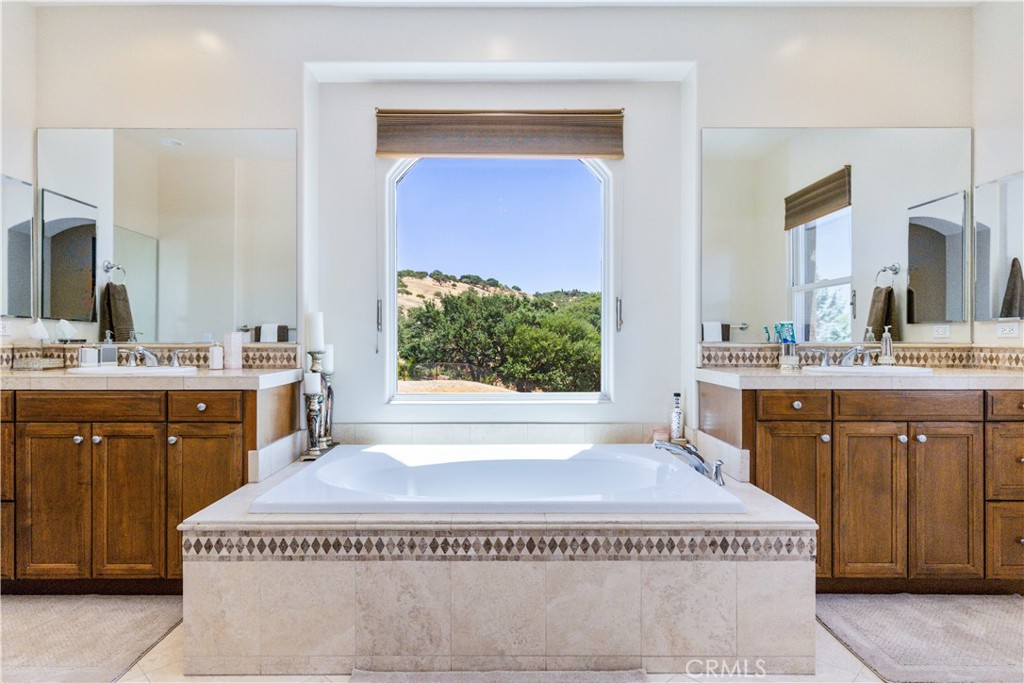 2191 Lake Ysabel Road Templeton, CA 93465 - Photo 47 of 73 a spacious bathroom with a granite countertop sink and a mirror
