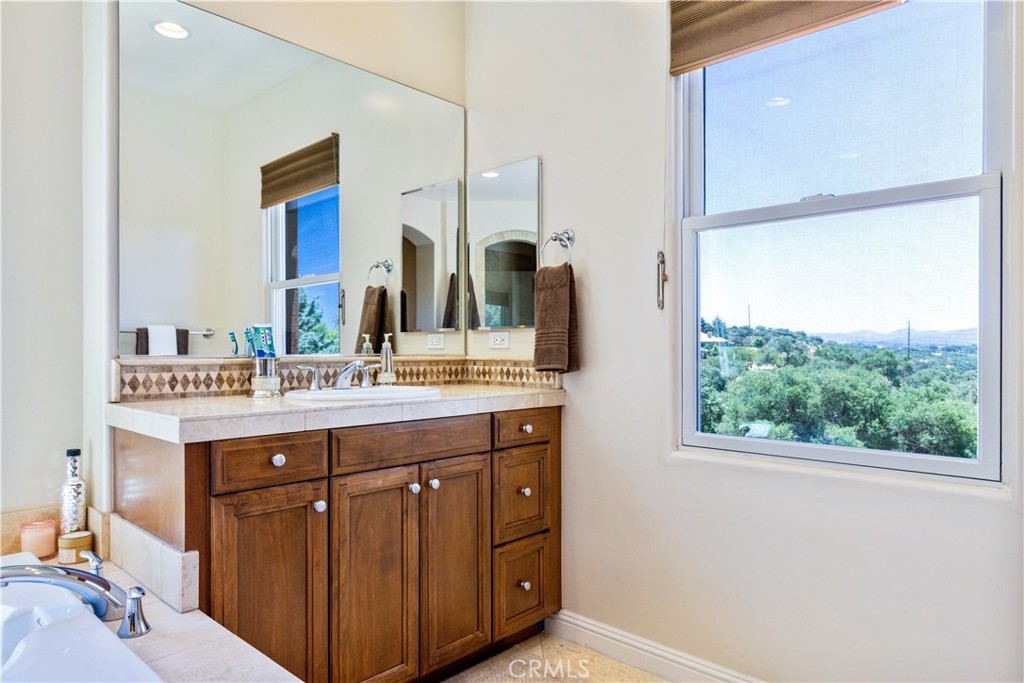 2191 Lake Ysabel Road Templeton, CA 93465 - Photo 51 of 73 a bathroom with a granite countertop sink and a mirror