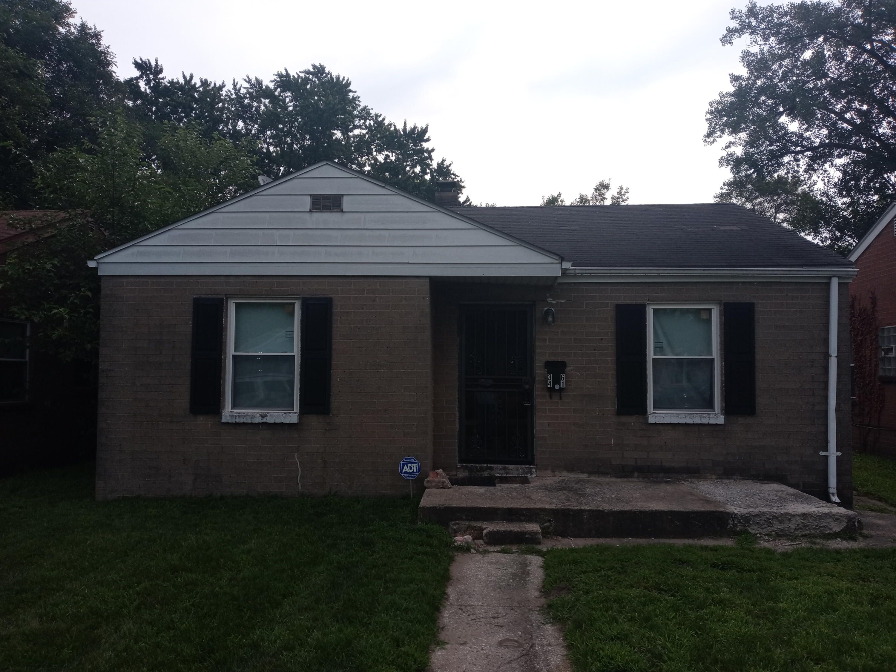 3461 Johnson Street Gary, IN 46408 - Photo 1 of 6 a front view of a house with garden