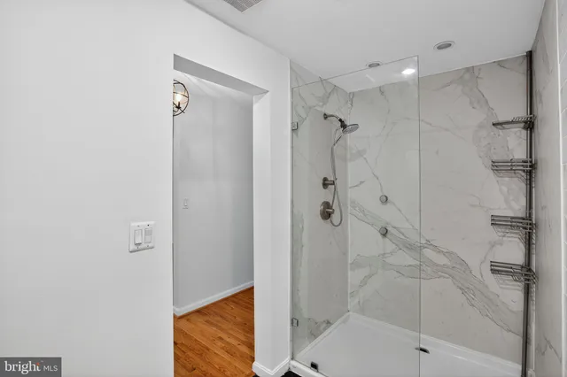 a bathroom with a bathtub and shower