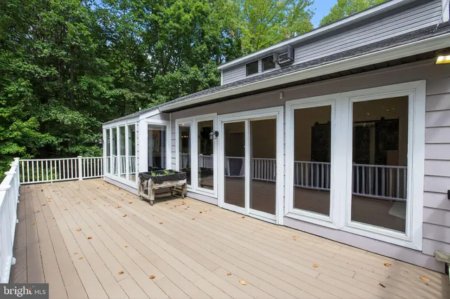 a balcony view with a seating space