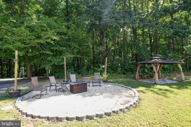 swimming pool view with a seating space