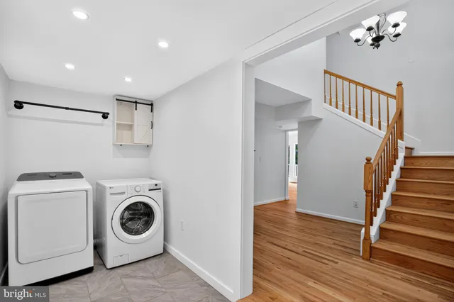 a view of a hallway with washer and dryer