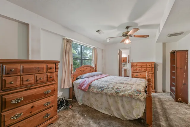 a bed room with a bed and a window