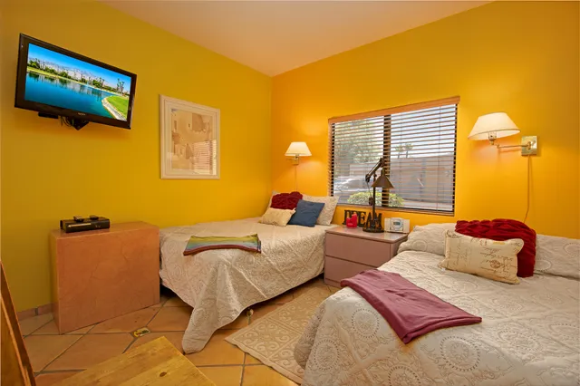 a bedroom with furniture and a window