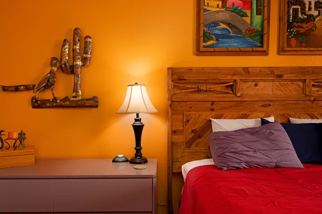 a bedroom with a bed and dresser