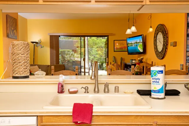 a kitchen with a sink and a large window