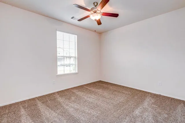 a view of a big room with carpet