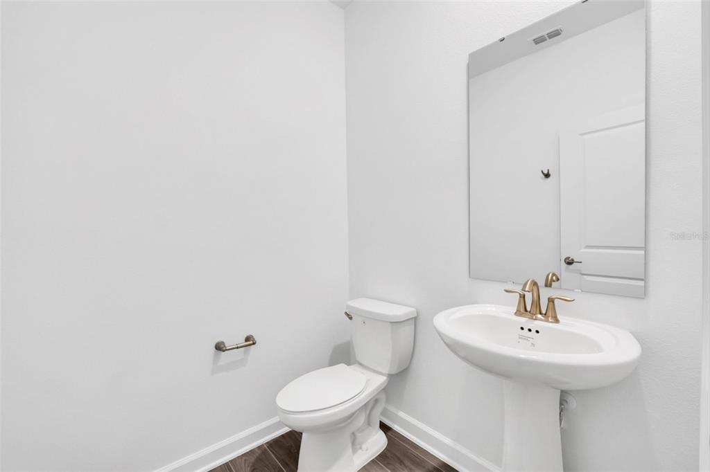 5768 Stephens Road St. Cloud, FL 34771 - Photo 19 of 50 a bathroom with a sink and a toilet