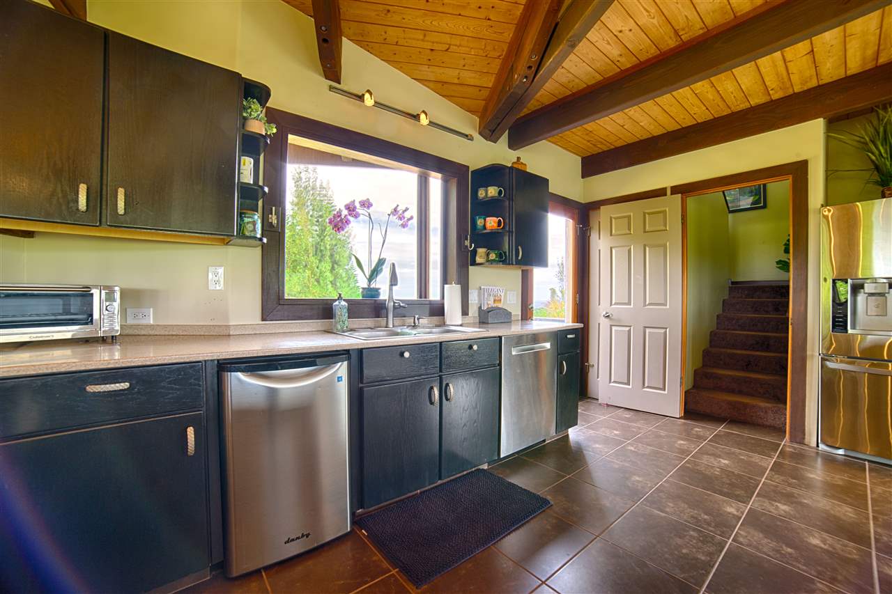 2311 Umi Place Haiku, HI 96708 - Photo 11 of 21 a kitchen with stainless steel appliances granite countertop a sink and cabinets