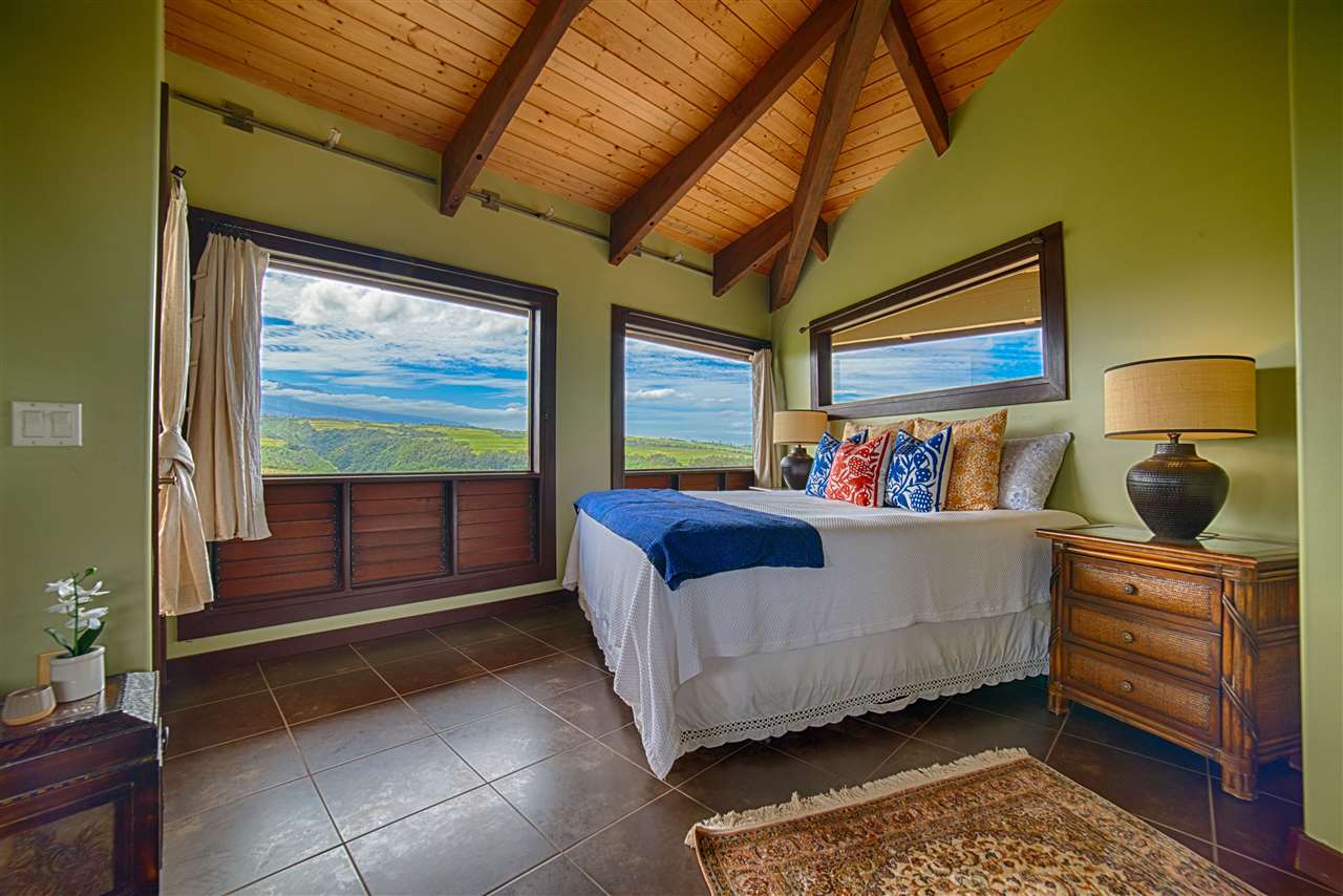 2311 Umi Place Haiku, HI 96708 - Photo 13 of 21 a bedroom with a bed and a window