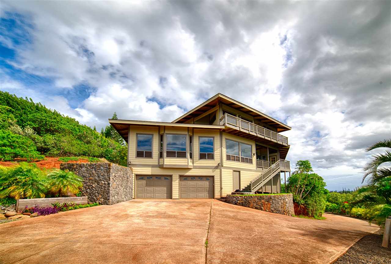 2311 Umi Place Haiku, HI 96708 - Photo 4 of 21 a front view of a house with a garden