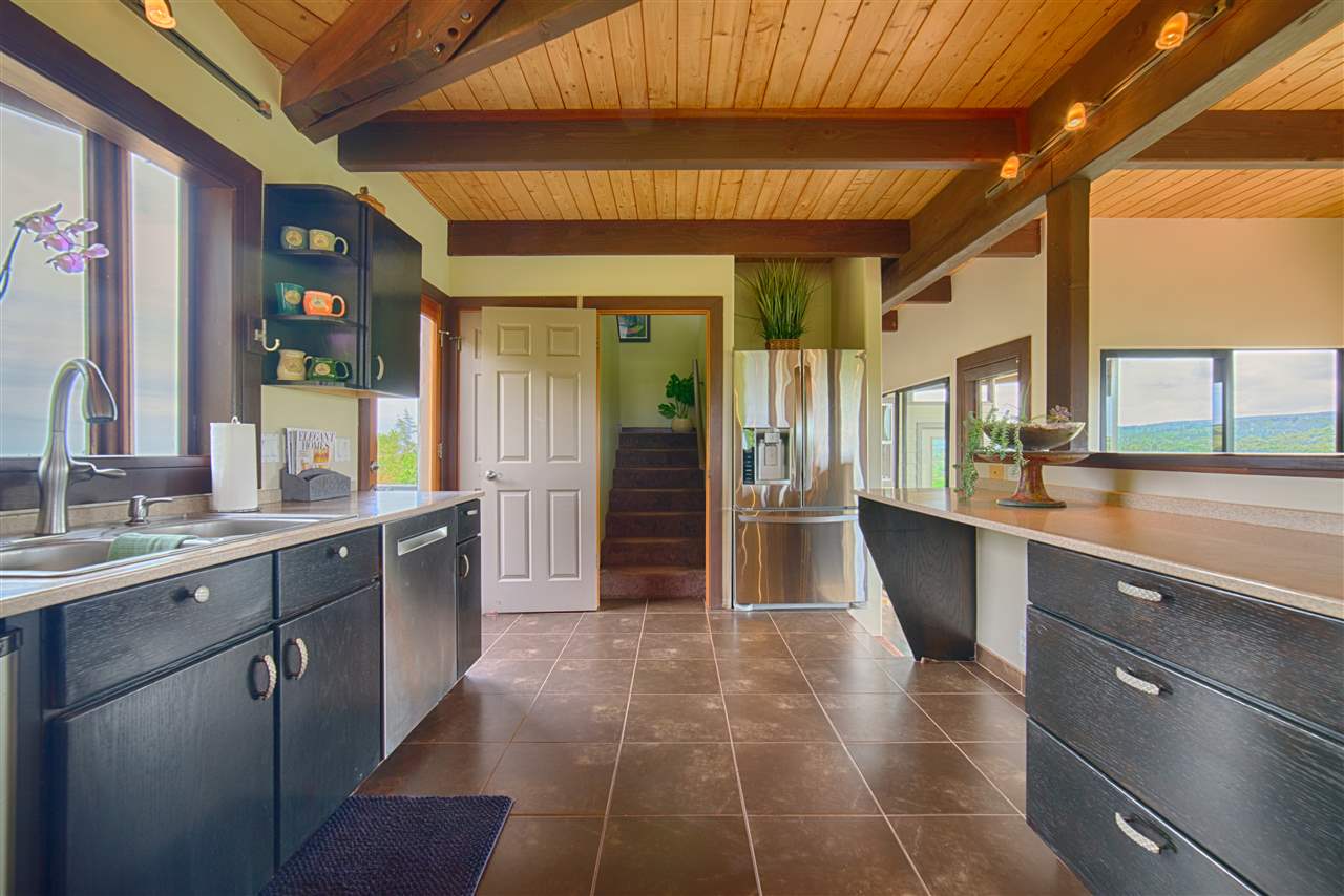 2311 Umi Place Haiku, HI 96708 - Photo 10 of 21 a view of a kitchen with a sink and a large window