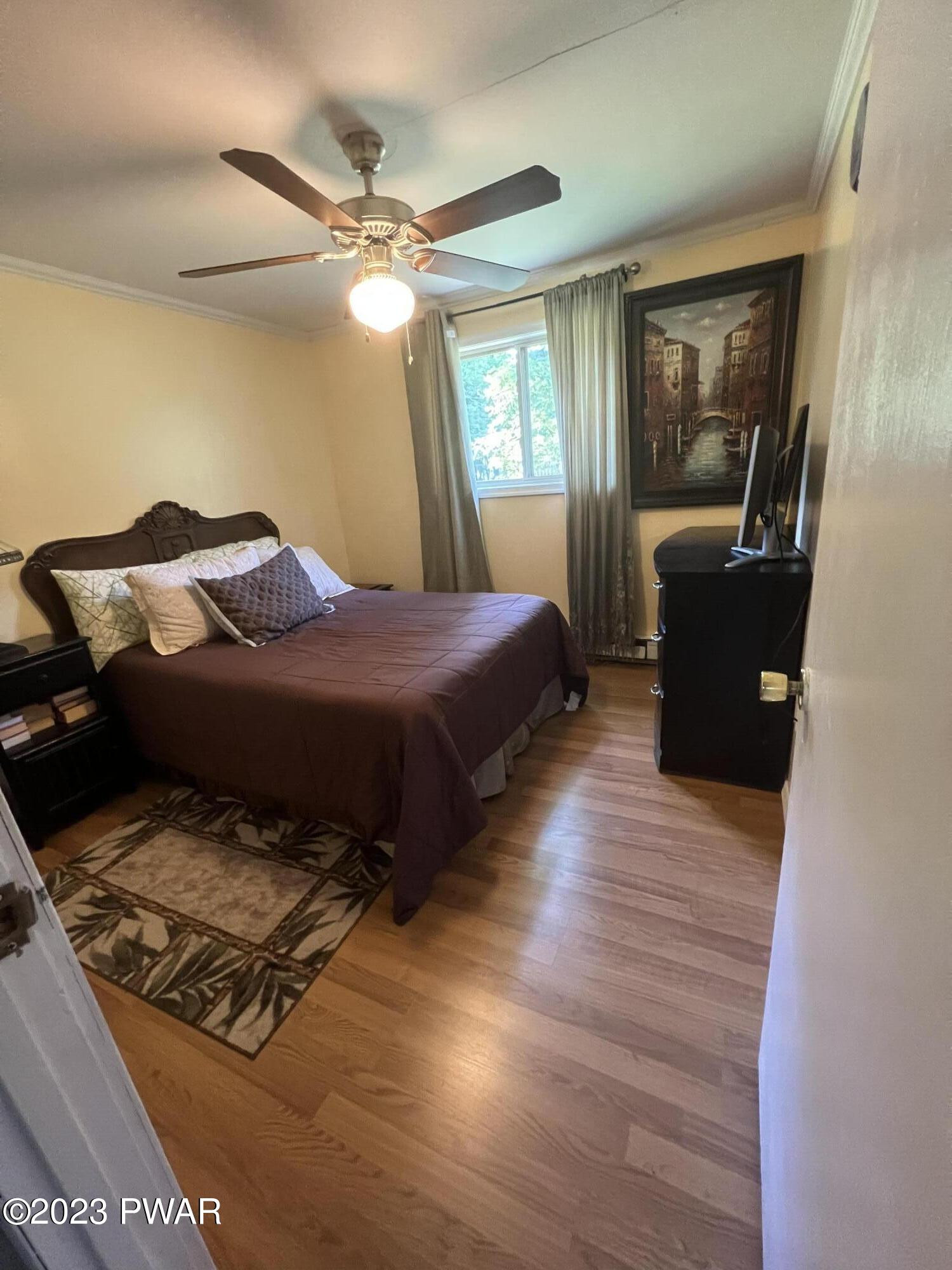 112 Stamford Road Dingmans Ferry, PA 18328 - Photo 22 of 26 a bedroom with a bed and window