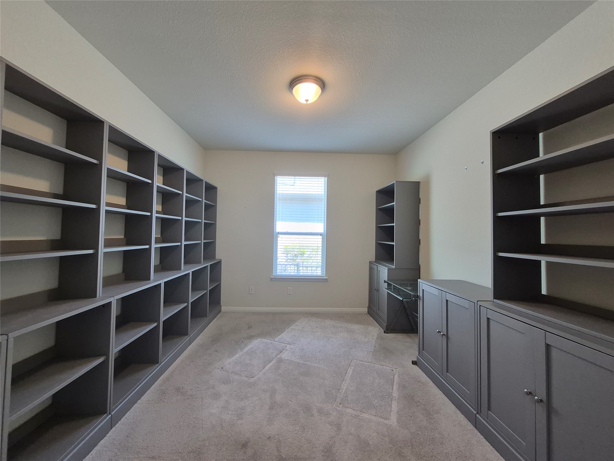 108 Calhoun Lane Georgetown, TX 78633 - Photo 13 of 27 Unfurnished office featuring light carpet and a textured ceiling