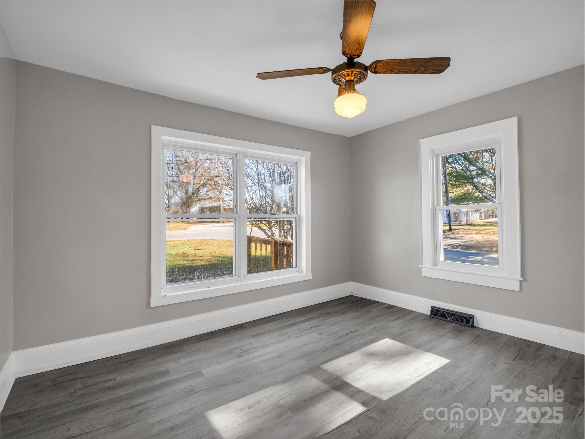 4501 Polkville Road Shelby, NC 28150 - Photo 15 of 35 a view of an empty room with a window and wooden floor