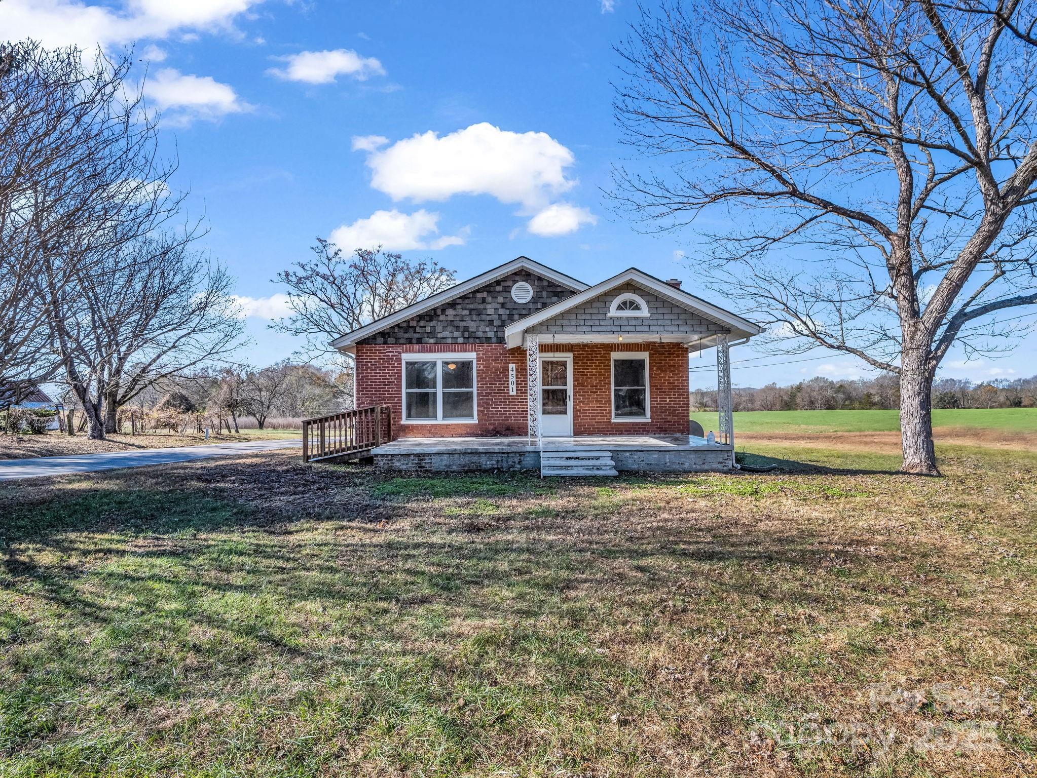 4501 Polkville Road Shelby, NC 28150 - Photo 22 of 35 a view of a house with a yard