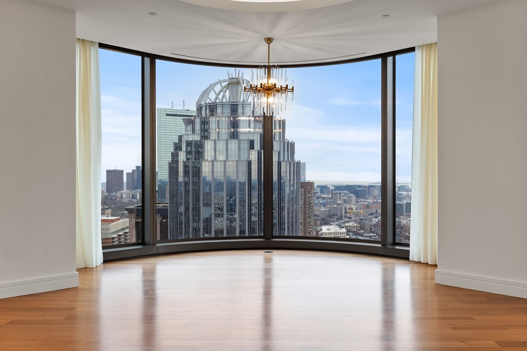 a view of a room with window wooden floor and door