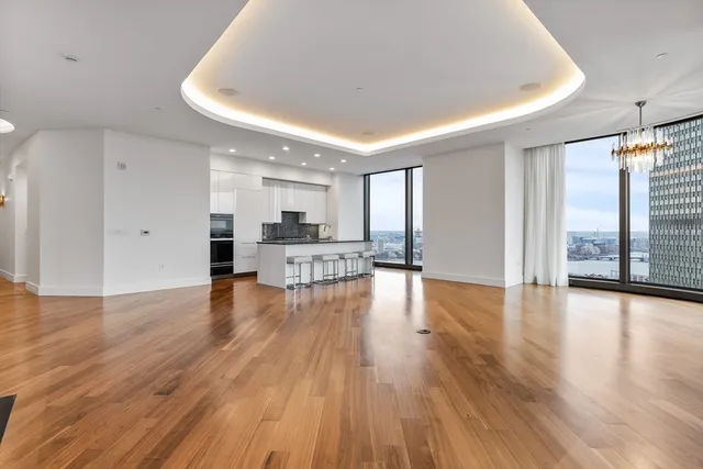 a view of a kitchen with a sink and a stove top oven
