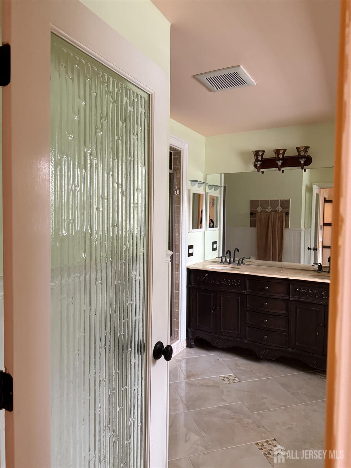 176 Nebula Road Piscataway, NJ 08854 - Photo 20 of 22 a spacious bathroom with a mirror and shower