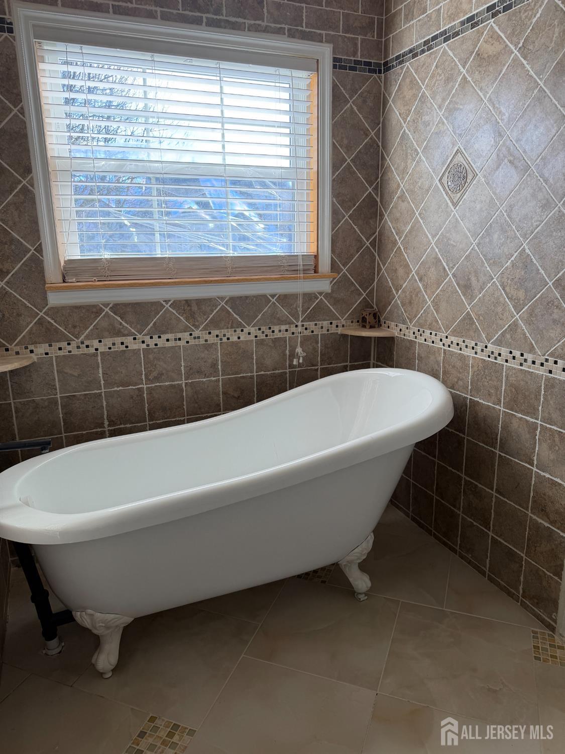 176 Nebula Road Piscataway, NJ 08854 - Photo 21 of 22 a bathroom with a bathtub and window