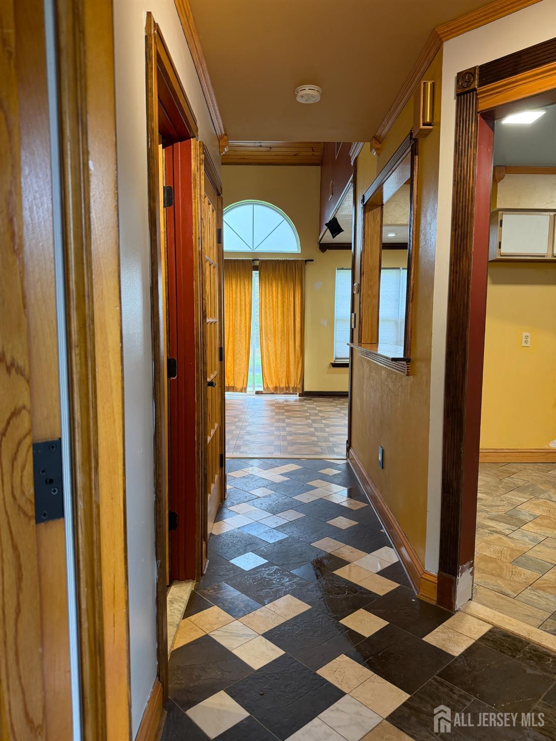 176 Nebula Road Piscataway, NJ 08854 - Photo 4 of 22 a view of a hallway with wooden floor and a bathroom