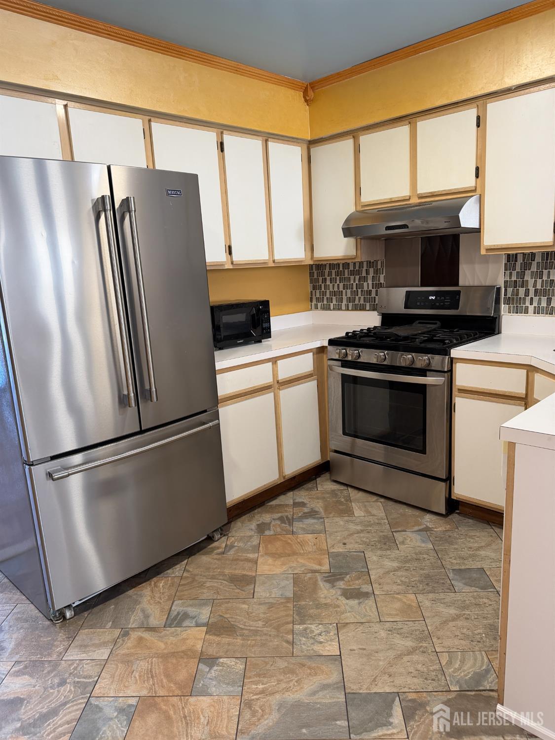 176 Nebula Road Piscataway, NJ 08854 - Photo 8 of 22 a kitchen with stainless steel appliances granite countertop a refrigerator sink and stove