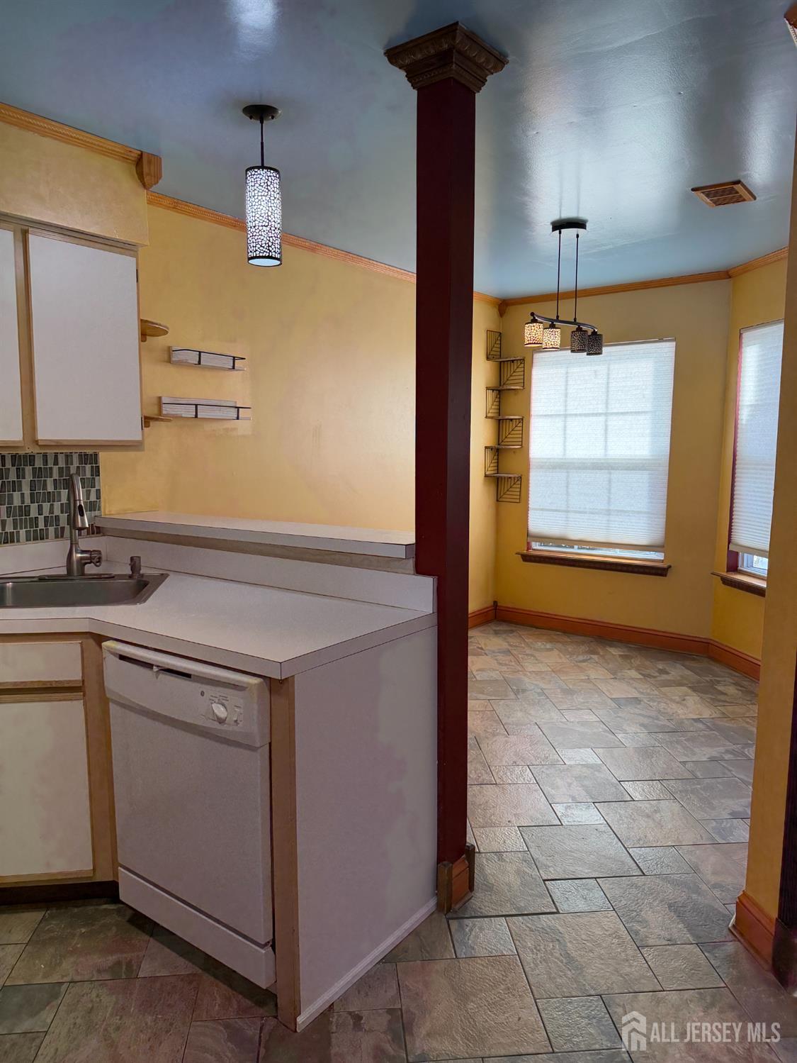 176 Nebula Road Piscataway, NJ 08854 - Photo 9 of 22 a view of a kitchen with a sink and a window