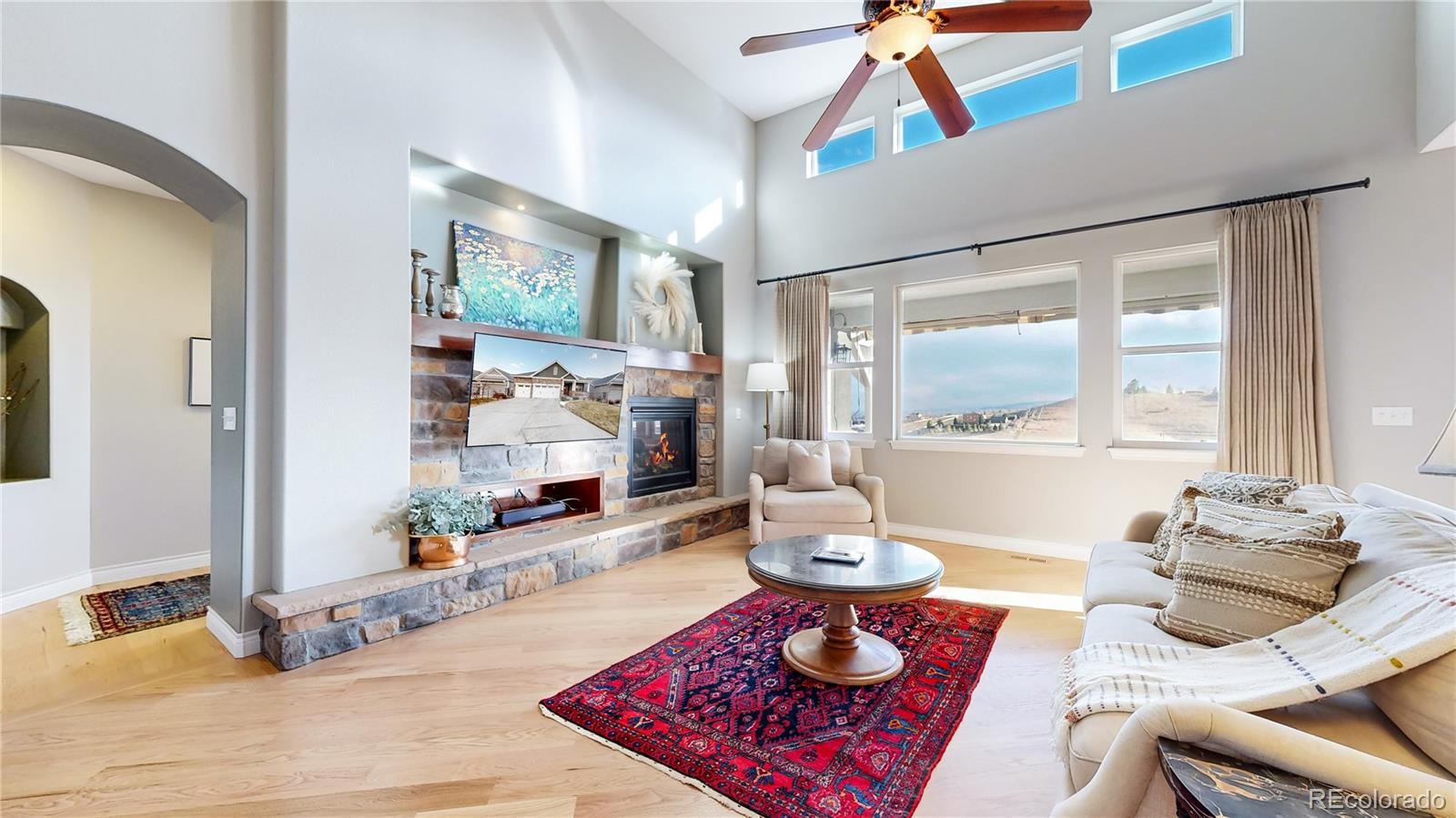 8400 Quaker Circle Arvada, CO 80007 - Photo 12 of 50 a living room with furniture and wooden floor
