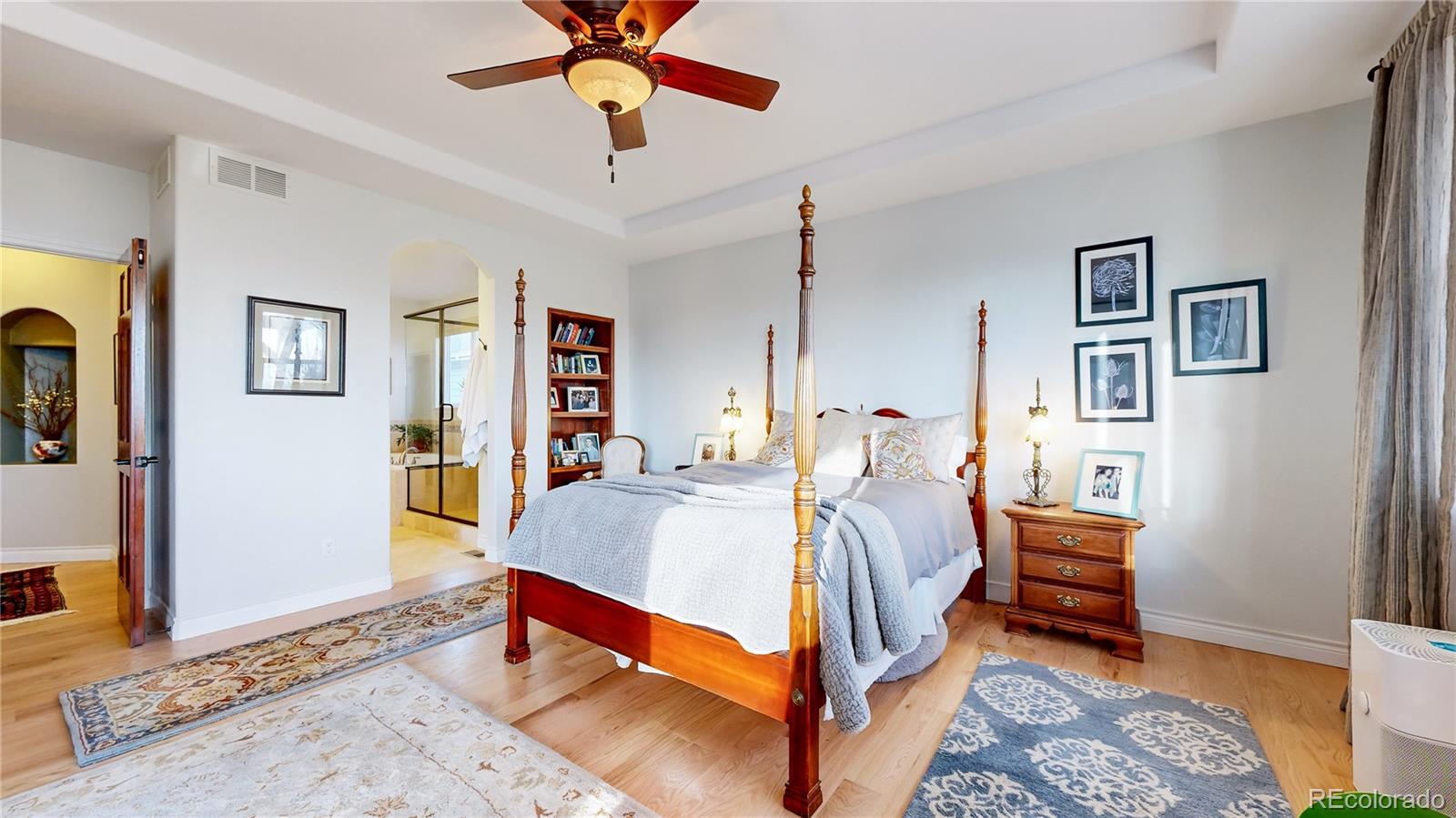 8400 Quaker Circle Arvada, CO 80007 - Photo 17 of 50 a bed room with a bed and a chandelier