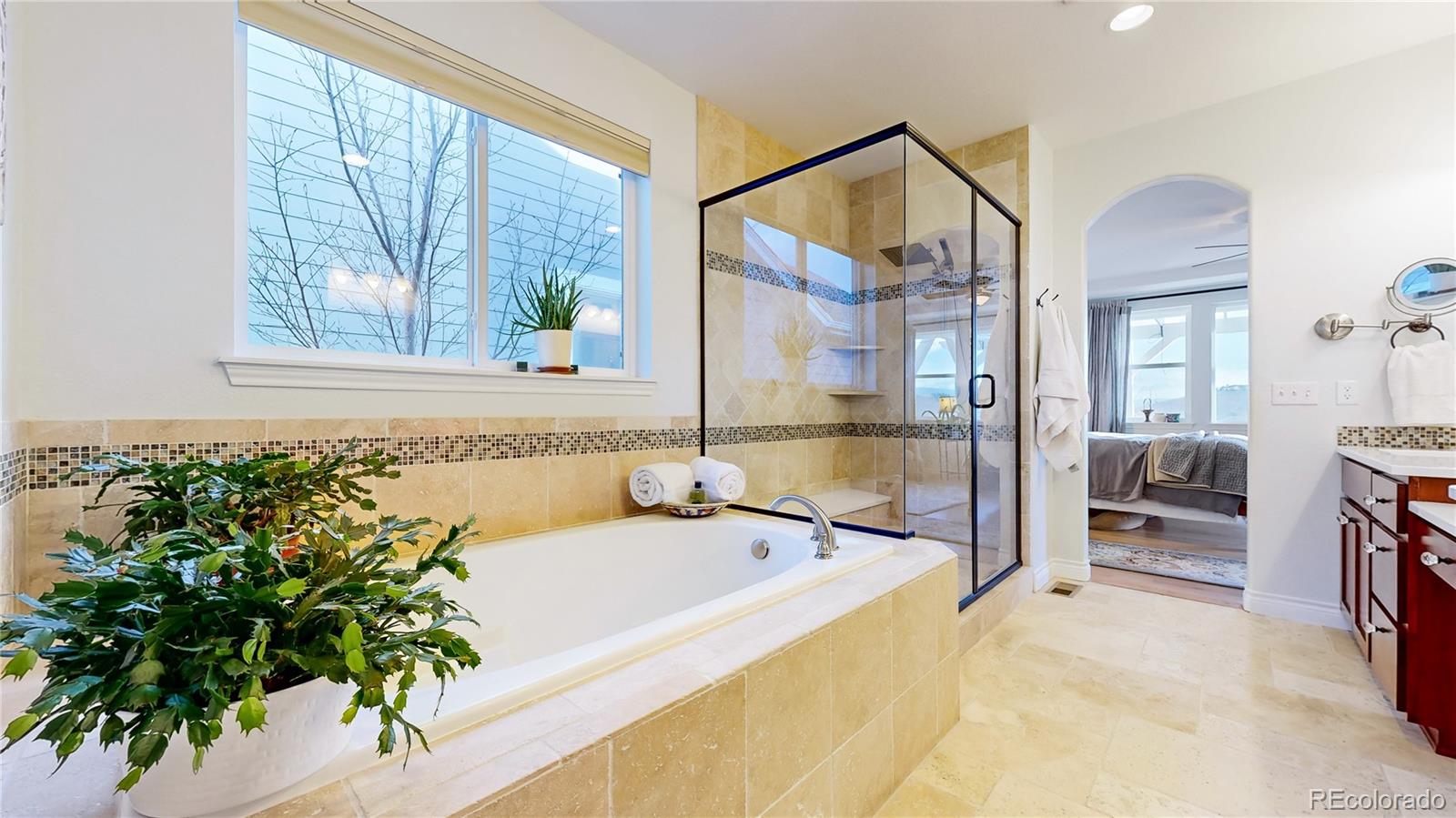 8400 Quaker Circle Arvada, CO 80007 - Photo 19 of 50 a spacious bathroom with a bathtub and a shower