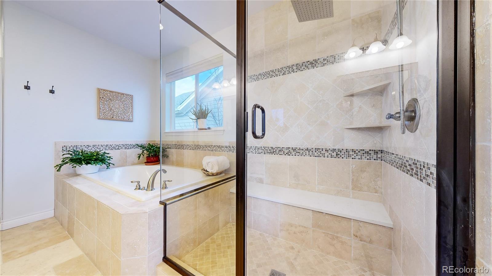 8400 Quaker Circle Arvada, CO 80007 - Photo 20 of 50 a bath tub sitting next to a bathroom sink