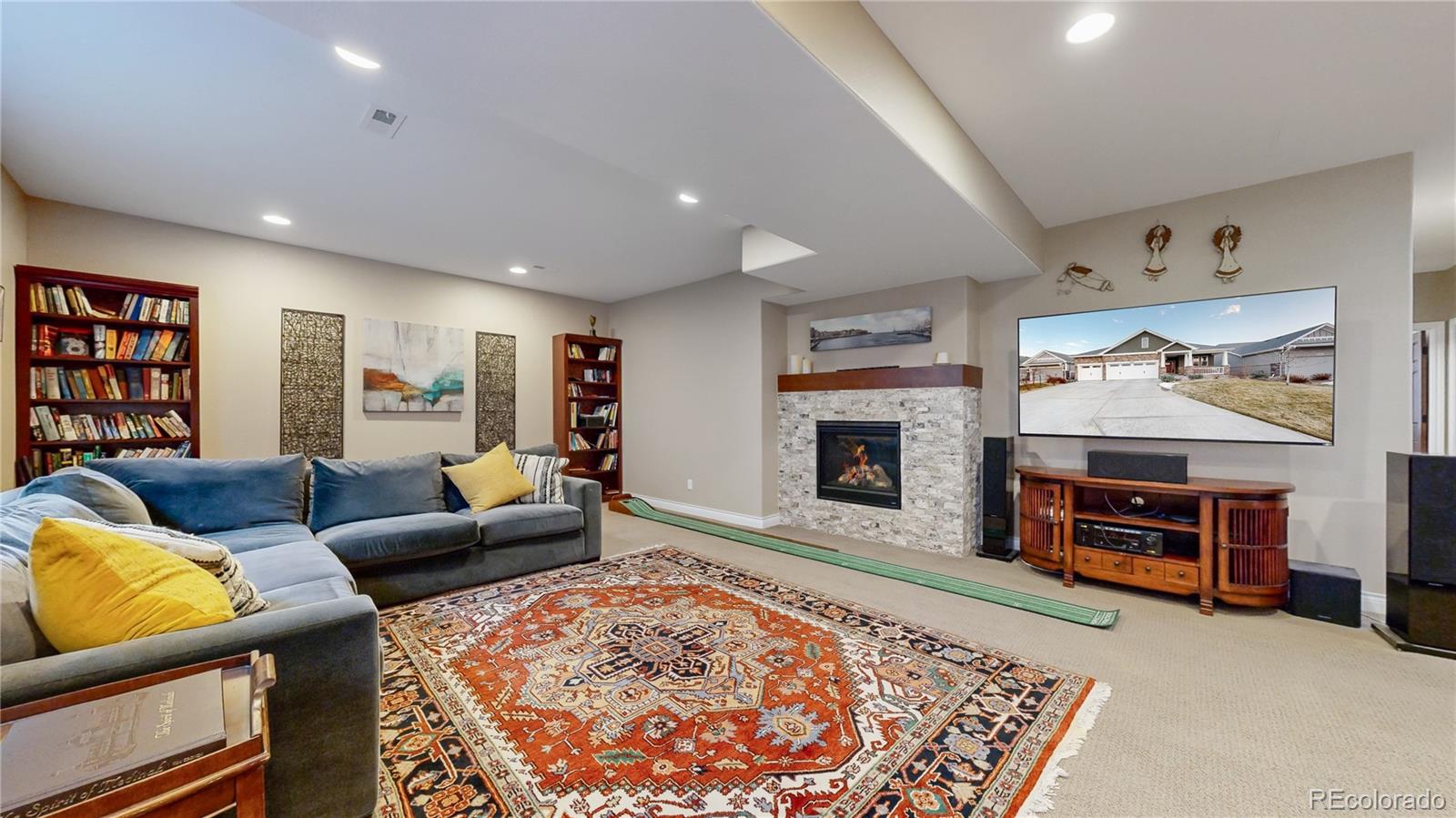 8400 Quaker Circle Arvada, CO 80007 - Photo 24 of 50 a living room with furniture and a fireplace