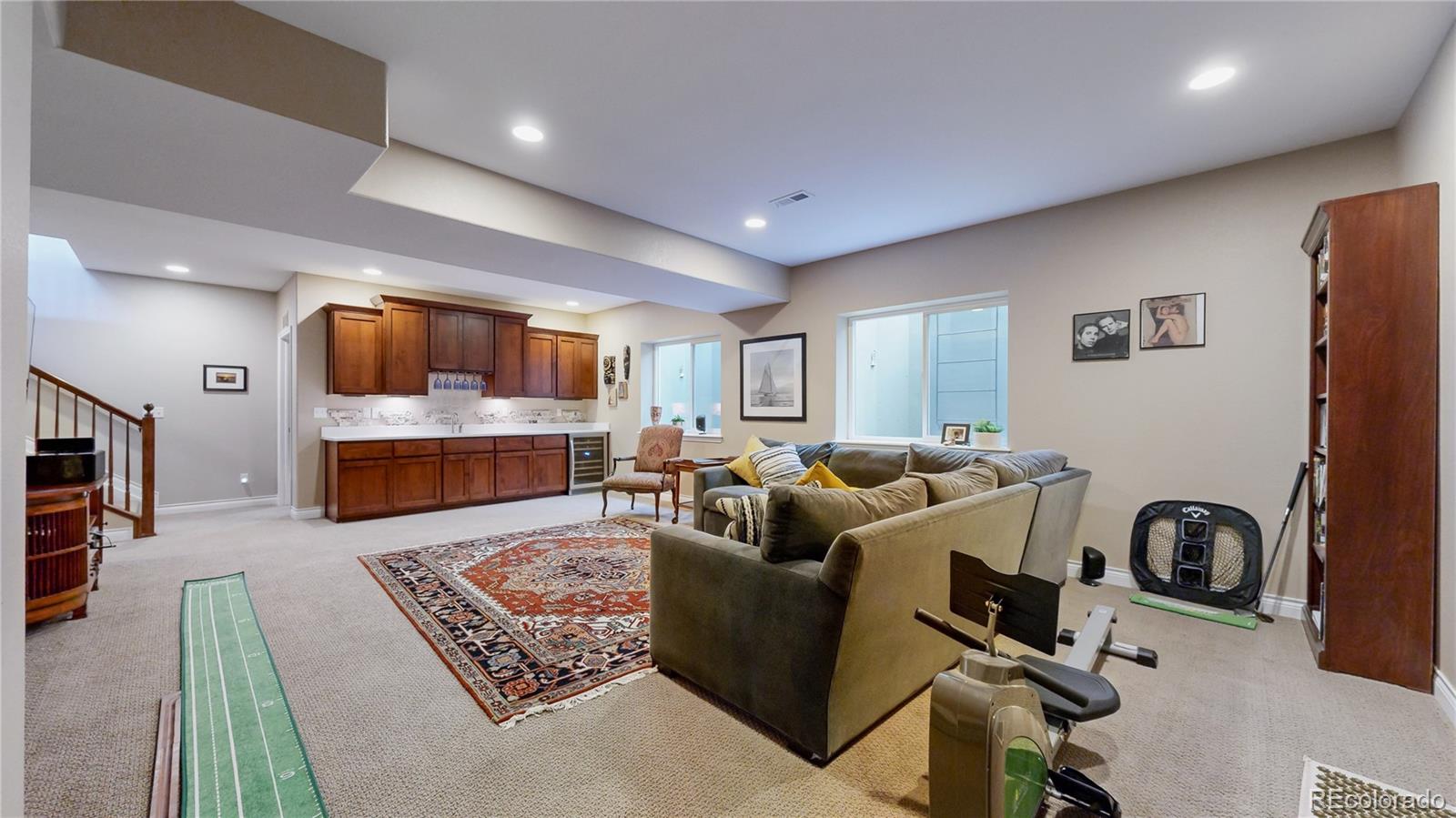8400 Quaker Circle Arvada, CO 80007 - Photo 25 of 50 a living room with furniture and a flat screen tv