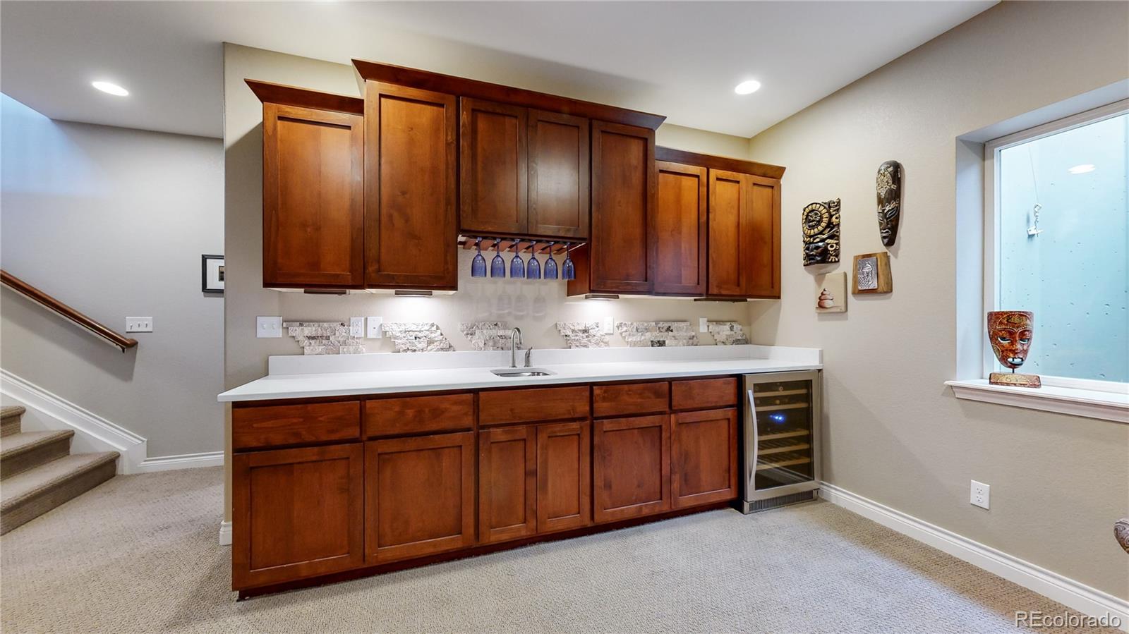 8400 Quaker Circle Arvada, CO 80007 - Photo 26 of 50 a bathroom with a sink double vanity and a mirror