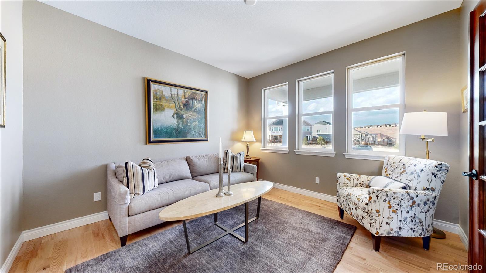 8400 Quaker Circle Arvada, CO 80007 - Photo 27 of 50 a living room with furniture and a large window