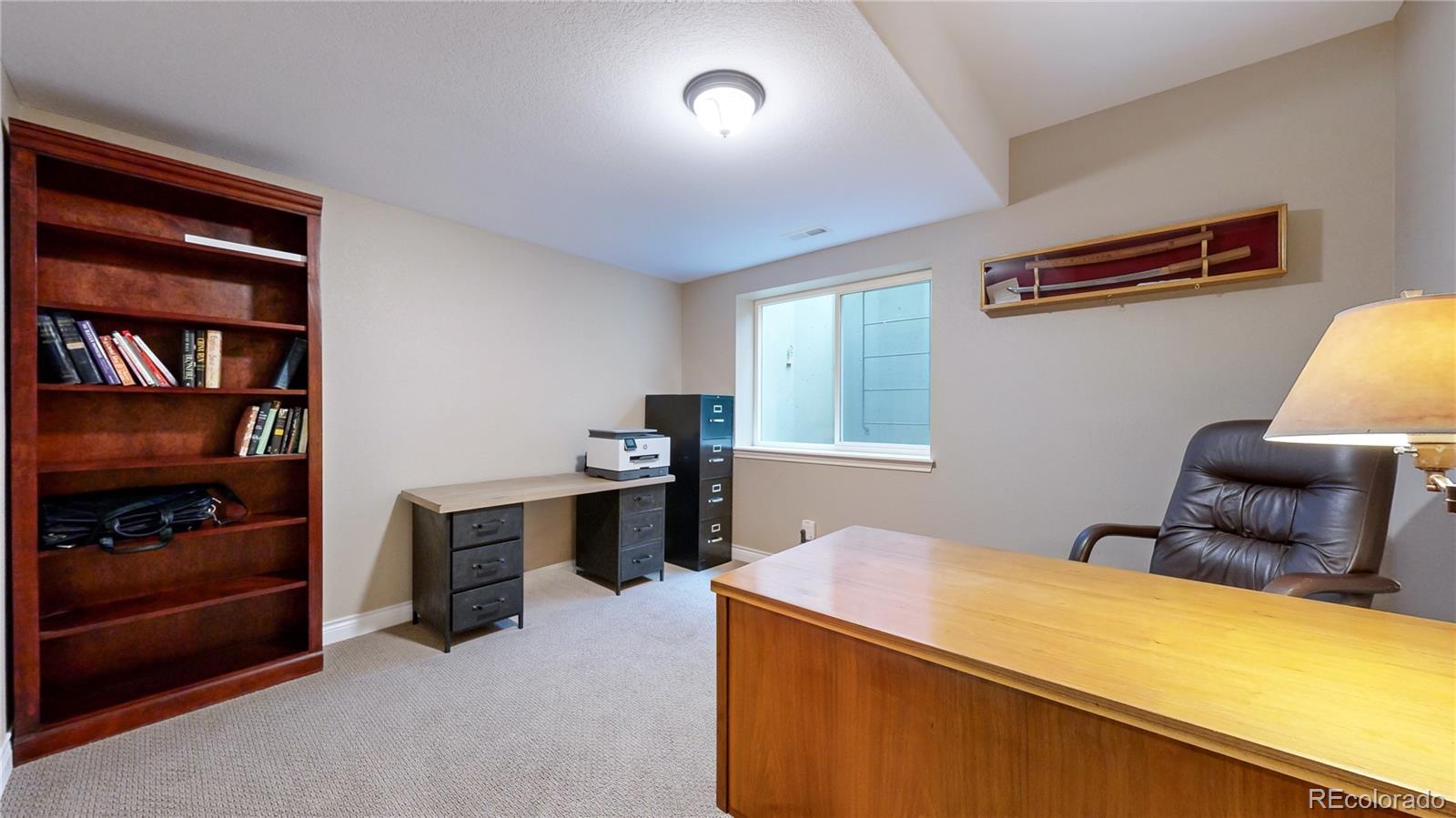 8400 Quaker Circle Arvada, CO 80007 - Photo 31 of 50 a bedroom with furniture and window