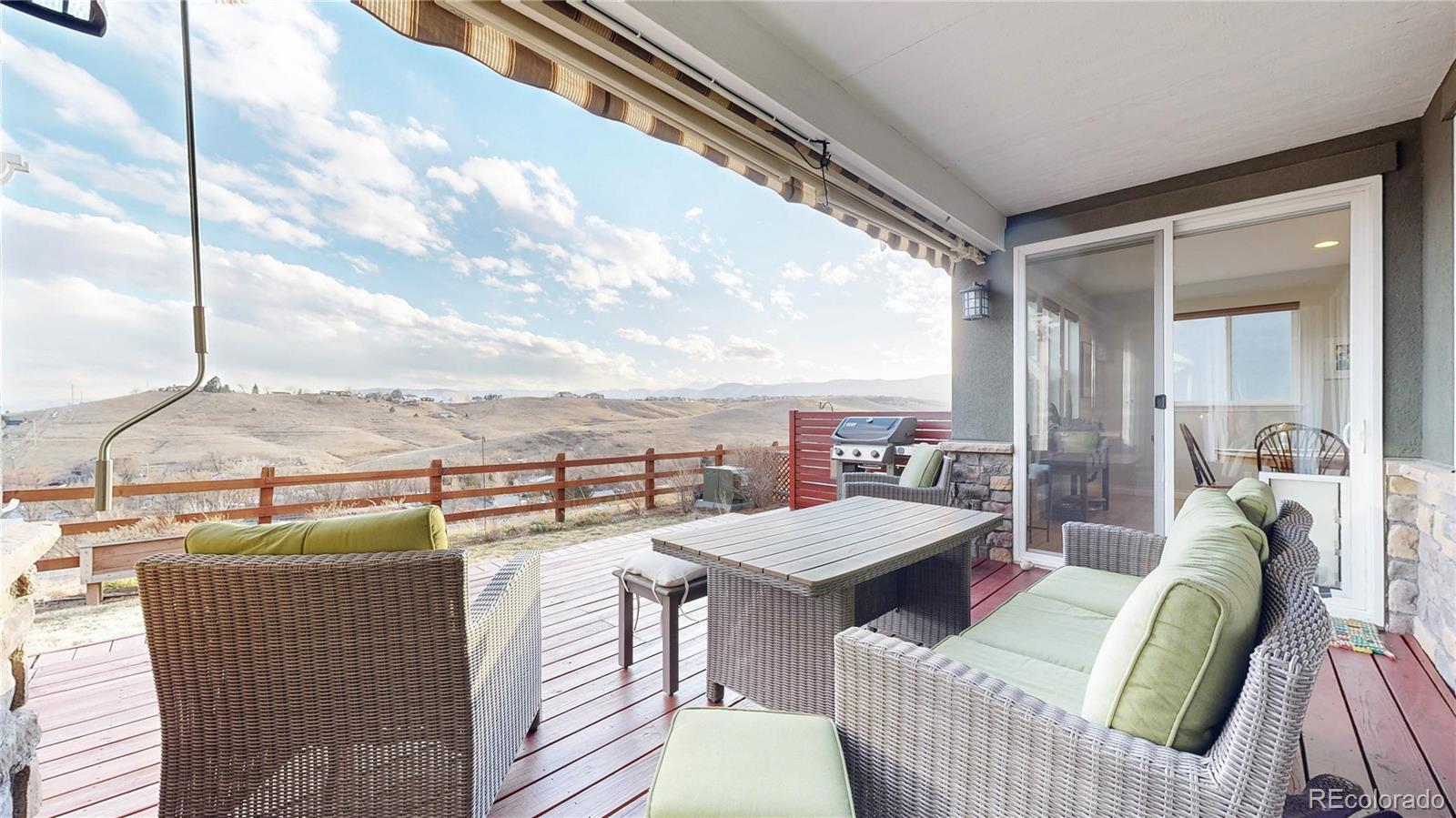 8400 Quaker Circle Arvada, CO 80007 - Photo 40 of 50 a balcony with furniture and a table