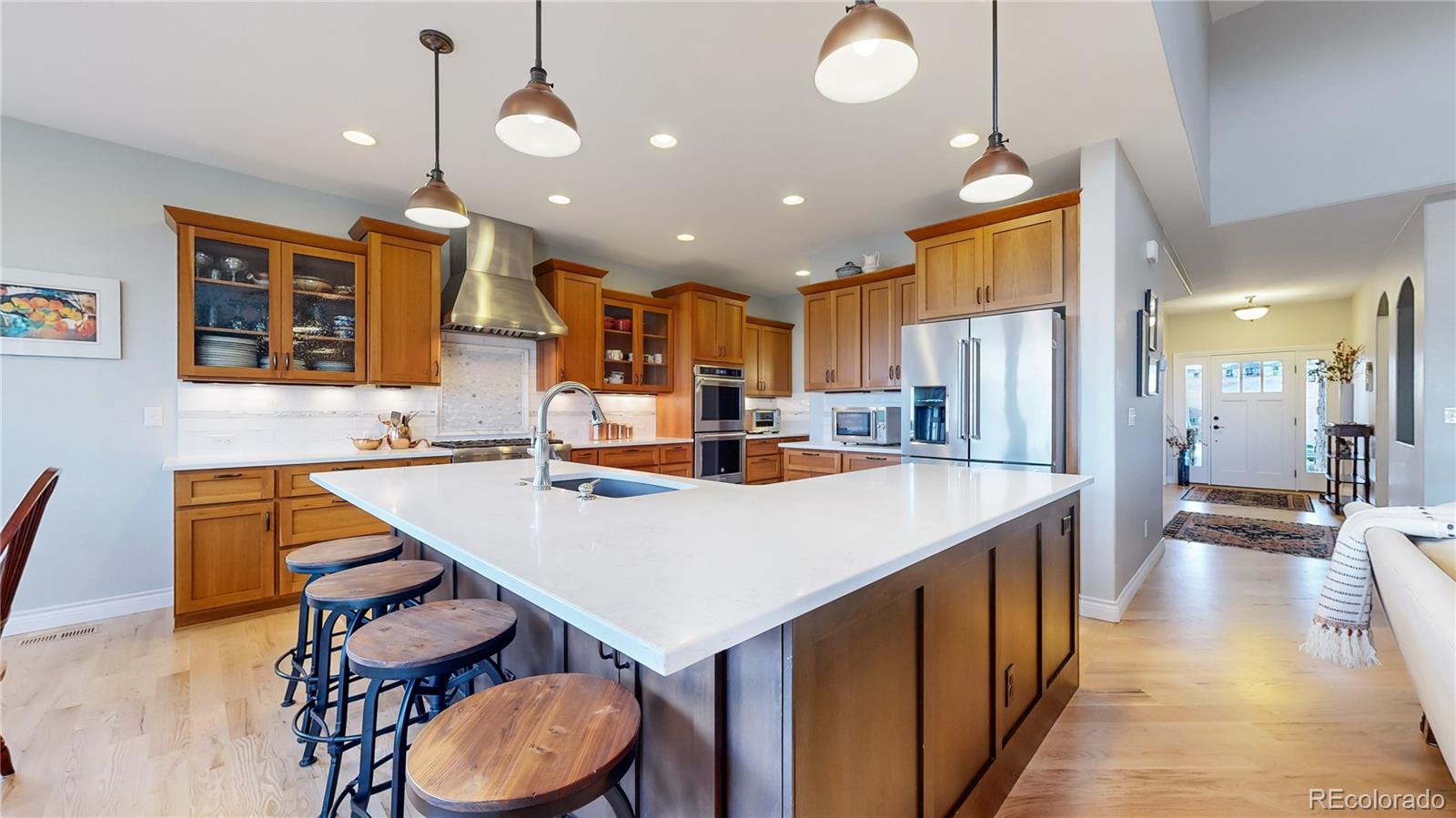 8400 Quaker Circle Arvada, CO 80007 - Photo 4 of 50 a large kitchen with a table and chairs