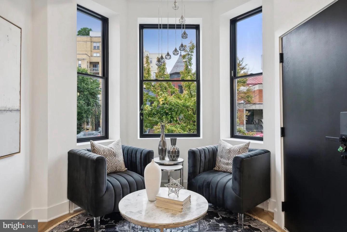 2015 13th Street Northwest, Unit 2 Washington, DC 20009 - Photo 3 of 42 a living room with furniture and a large window