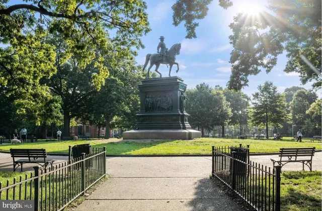 a view of brick house with large windows