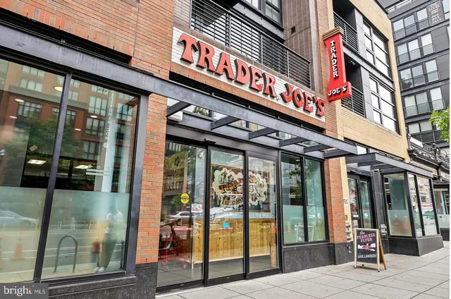 a front view of a building with parking