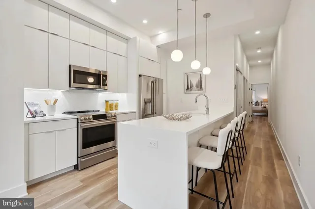 a kitchen with a stove and a microwave